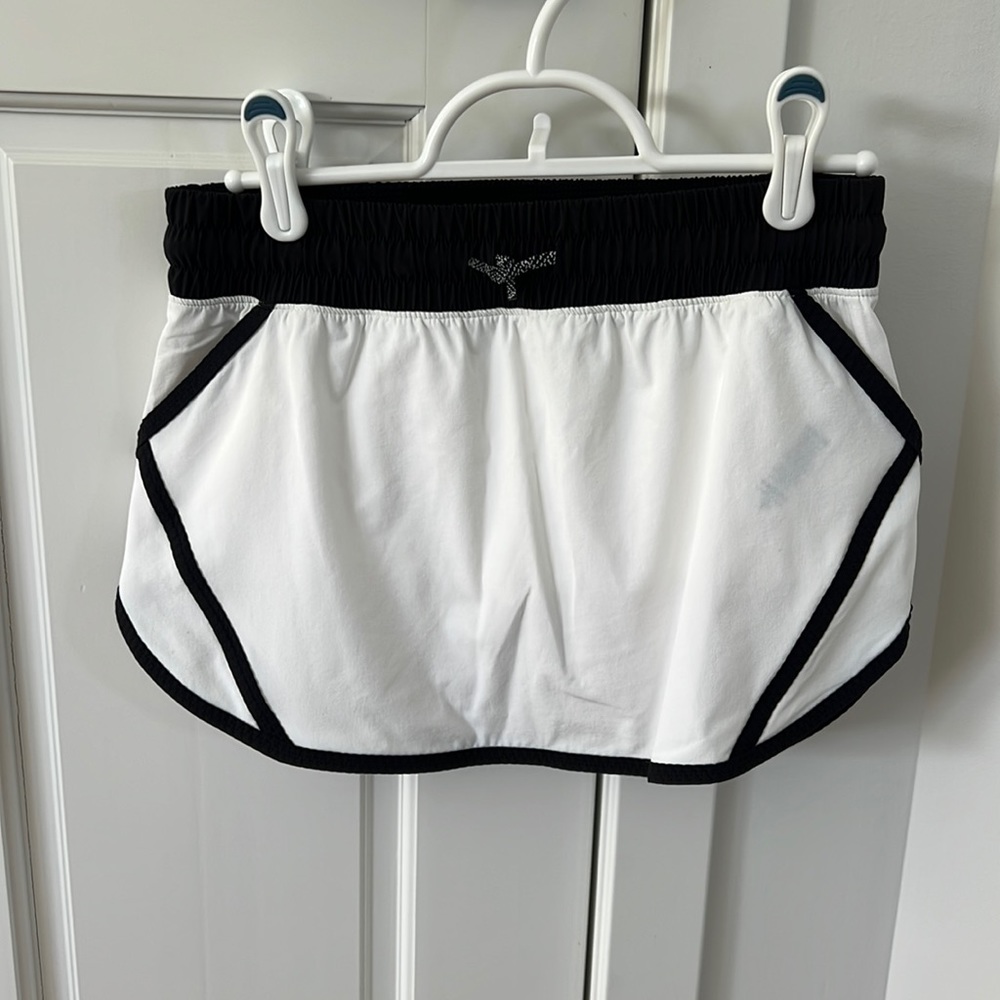 Ivivva girls. White skirt with black trim. Size 12.